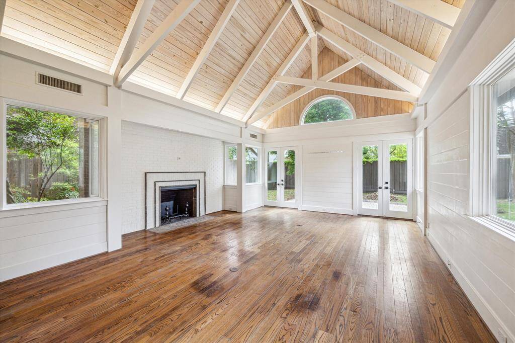 Very large great room has a brick fireplace