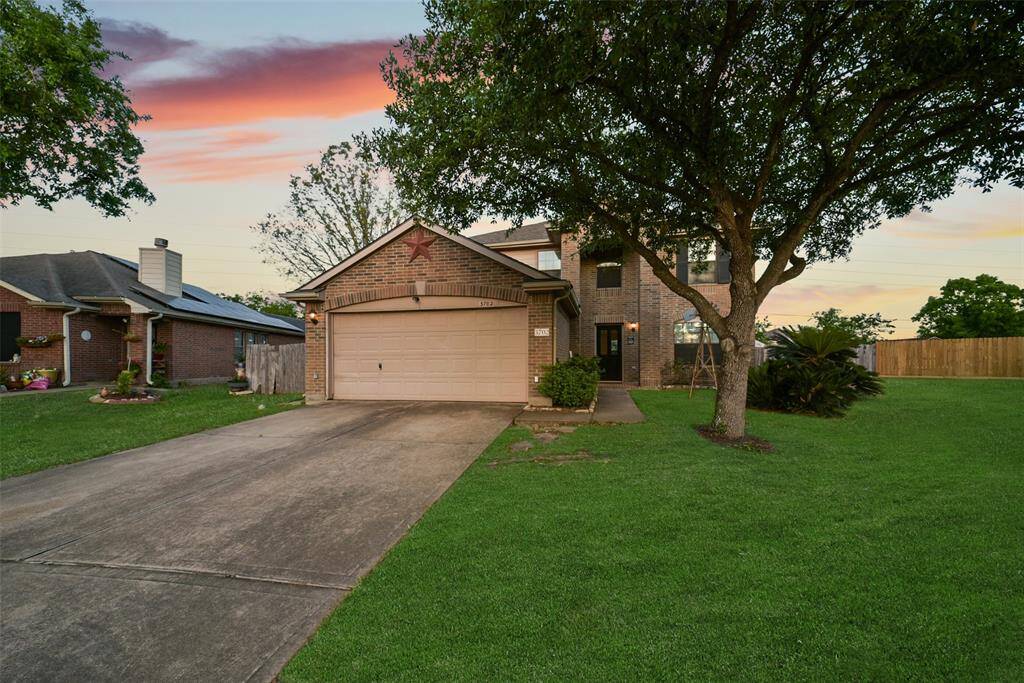 Welcome home to 3702 Pebble Garden Lane! Nestled beneath a mature shade tree and glowing under a Texas sunset, this classic two-story brick beauty offers charm, space, and a whole lot of curb appeal.