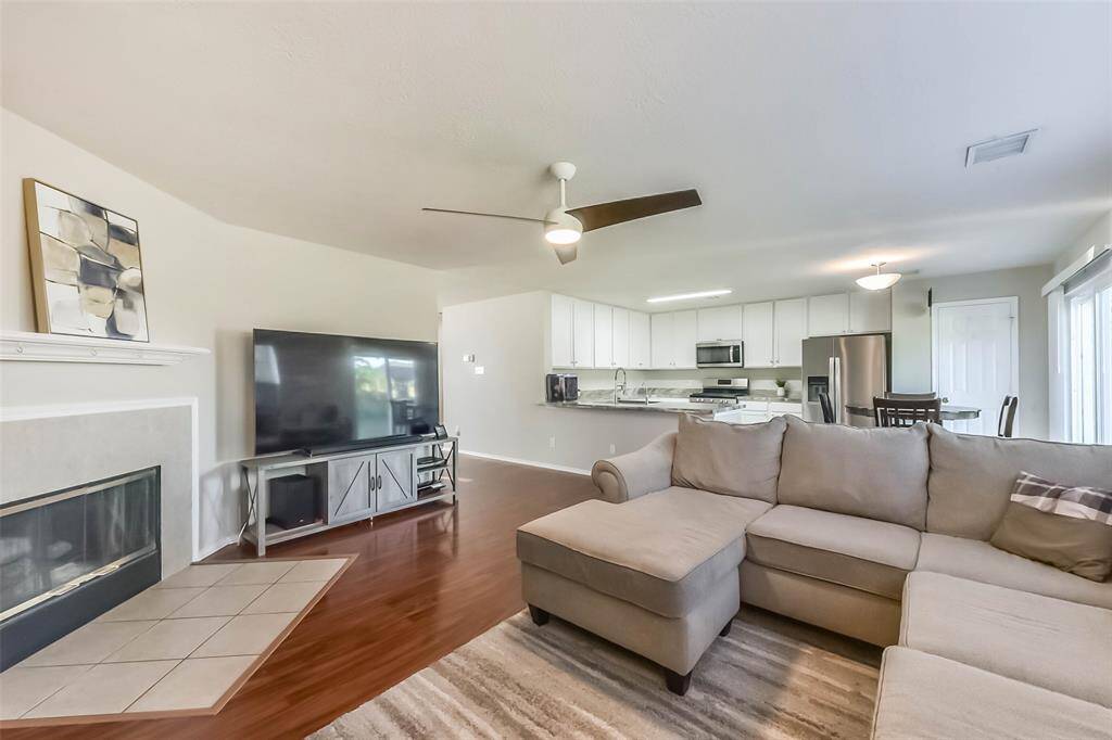 Movie nights just got an upgrade! The open-concept layout seamlessly connects the living area to the kitchen and dining space—perfect for entertaining, multitasking, or just keeping an eye on the snacks.