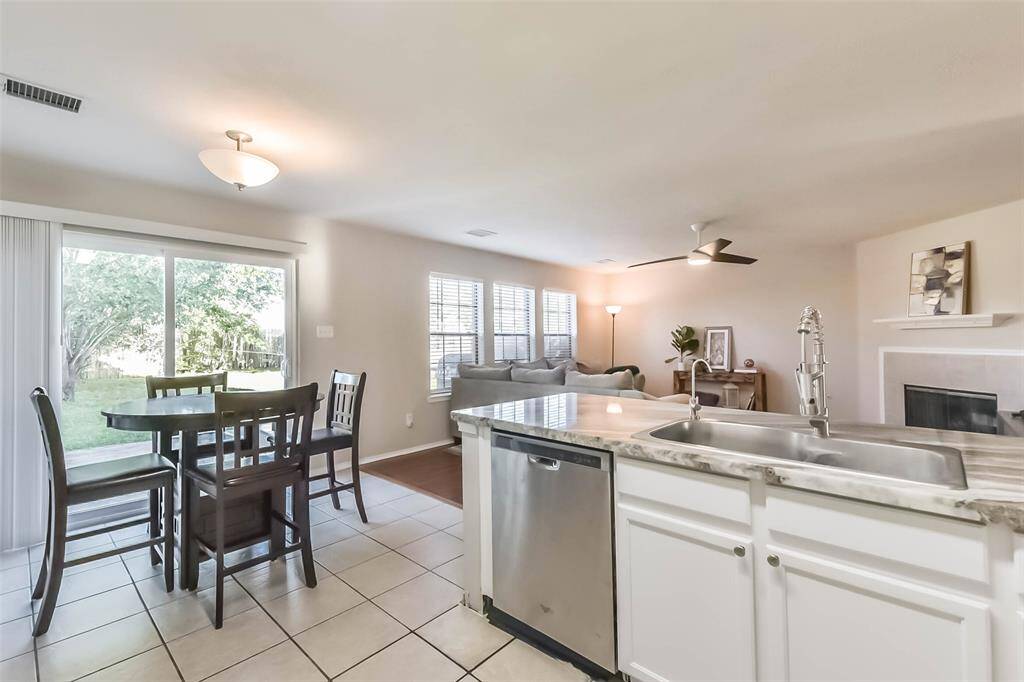 Open-concept perfection. Whether you're cooking, entertaining, or helping with homework at the breakfast bar, you’ll stay connected to all the action in the living room and dining space.
