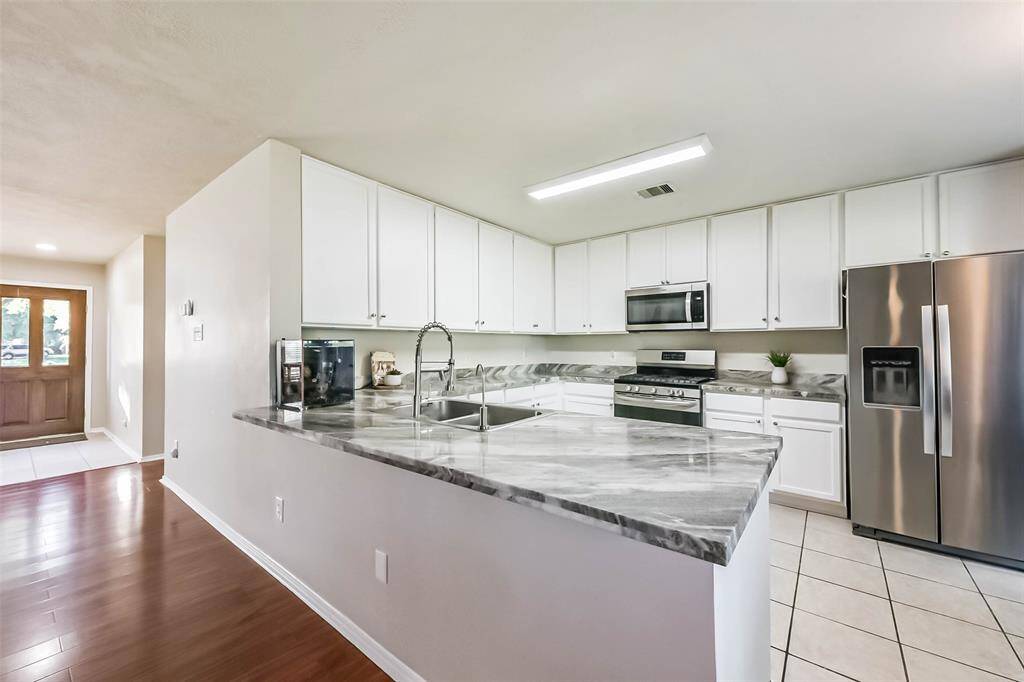 From front door to fridge, this kitchen is the heart of the home—with tons of counter space, pantry storage, and a layout that just makes life easier.