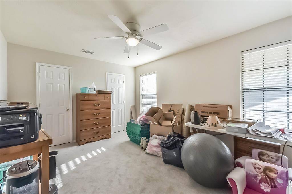 Currently used as a flexible storage and office space, Bedroom 3 is a blank slate with great potential and lots of light.