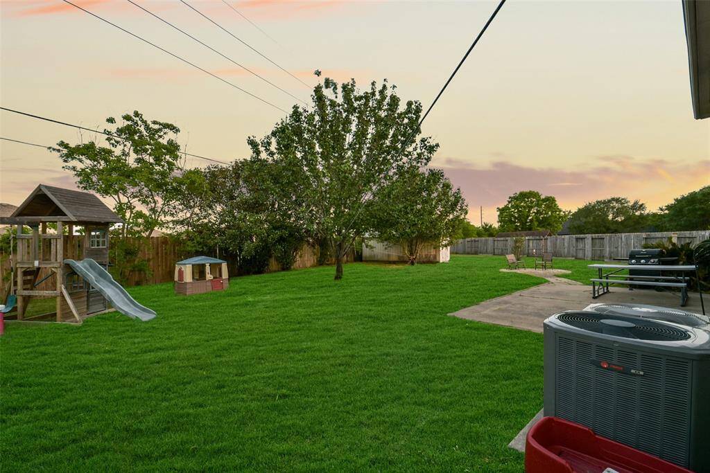 Bird’s-eye view of your private paradise! Sitting on a generous 13,086 sq ft lot (just under 1/3 acre!), this backyard offers endless possibilities—and with no back neighbors and lush greenspace behind, privacy is a major bonus.