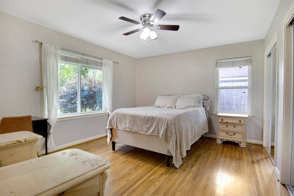 Large primary bedroom with thoughtfully designed layout, featuring his and hers closets.