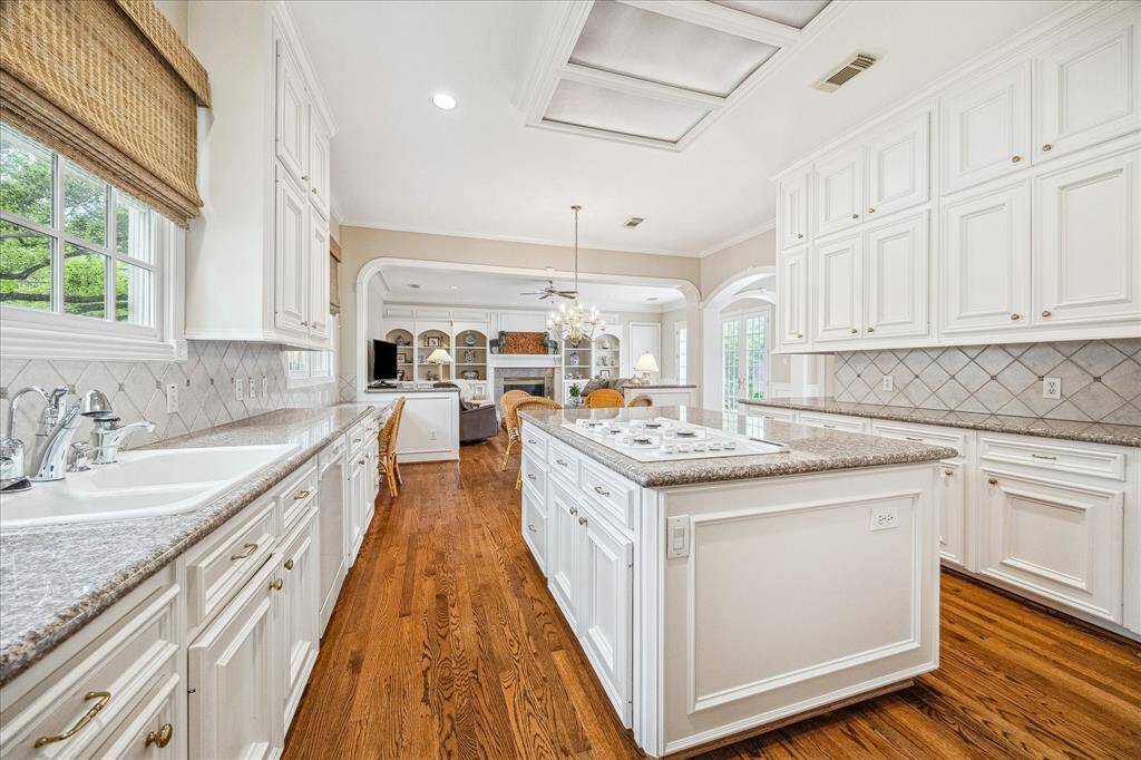 This view from the kitchen is looking towards the family room showcasing the open floor plan perfect for entertaining & family living.