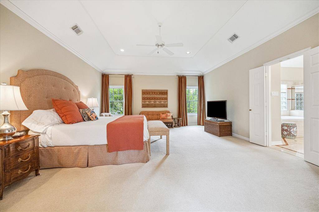 The primary bedroom is quite large and provides an oasis. the door on the right leads to the bath.