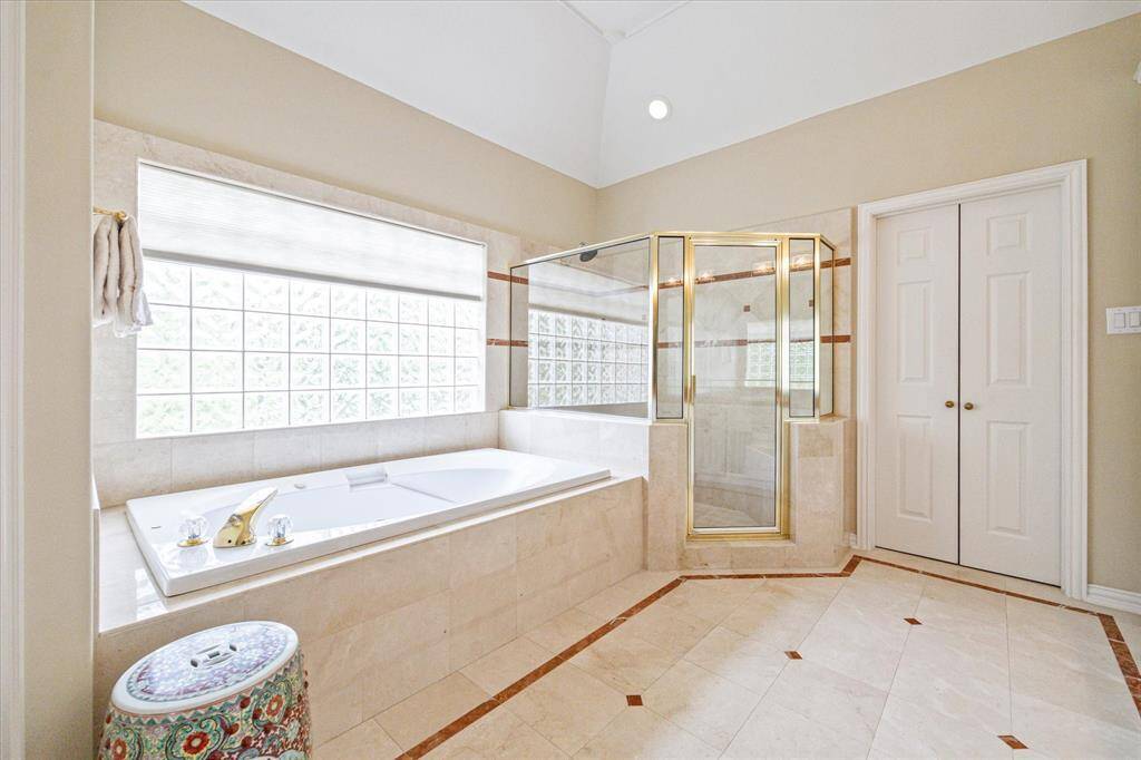 The double doors lead into the fabulous primary closet. Note the amount of natural light from the huge window.