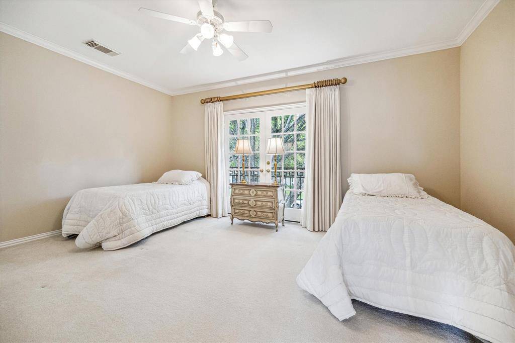 Another second floor bedroom that is light filled.