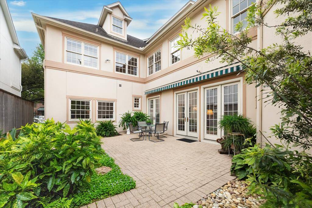 The beautiful yard is the perfect spot for a garden party.