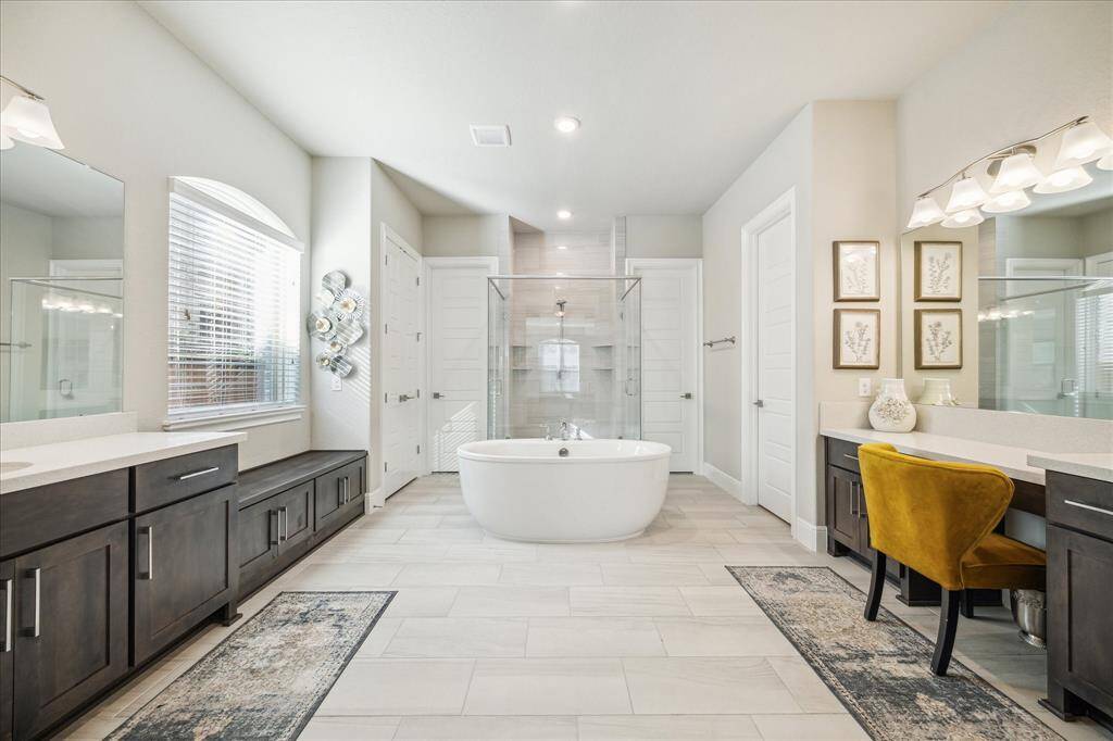 Large primary bathroom retreat. Two large walk in closets and one of them connects to the utility room!