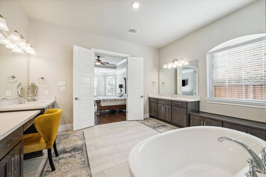Dual vanities with tons of counter space.