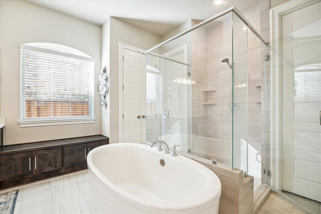 Separate shower and soaking tub.