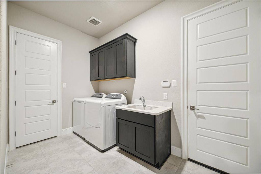 Utility/MUD room that leads to the two car garage wing.