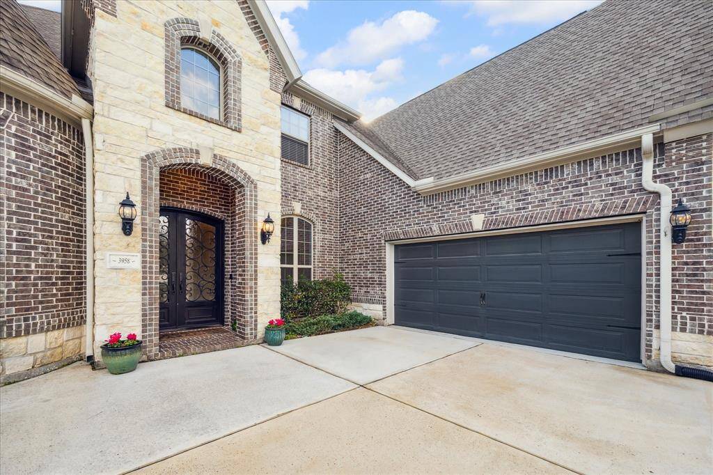 Three car garage with separate garage wings.