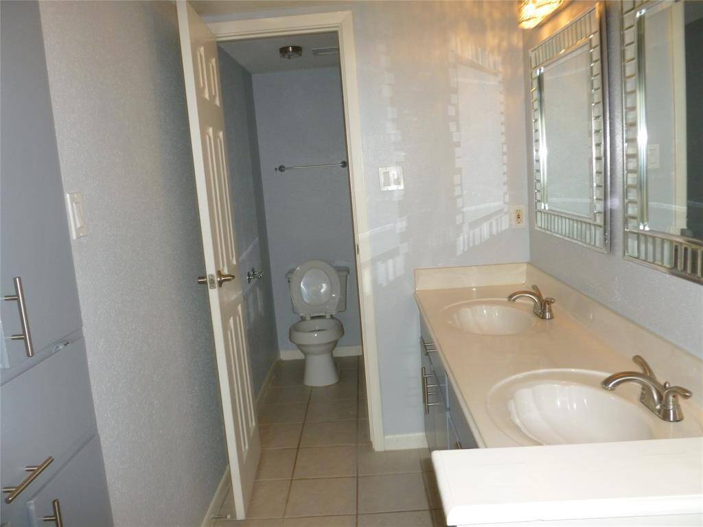 Primary bath has a vanity area with double sinks