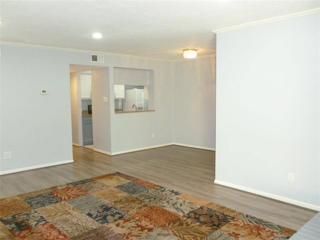 living and dining area are adjacent to kitchen.