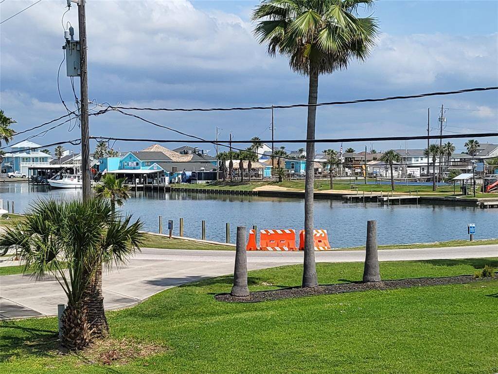 View of marina, restaurant, tennis court, pool