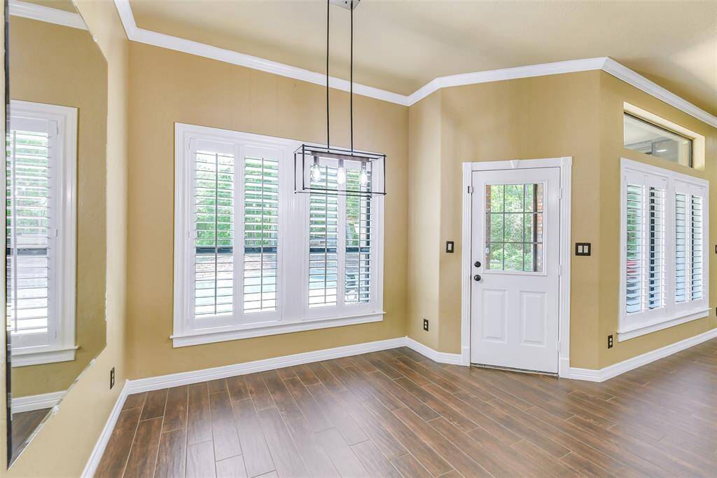 Step out of your home to a large covered patio. This portion of the patio has a remote controlled screened in feature.