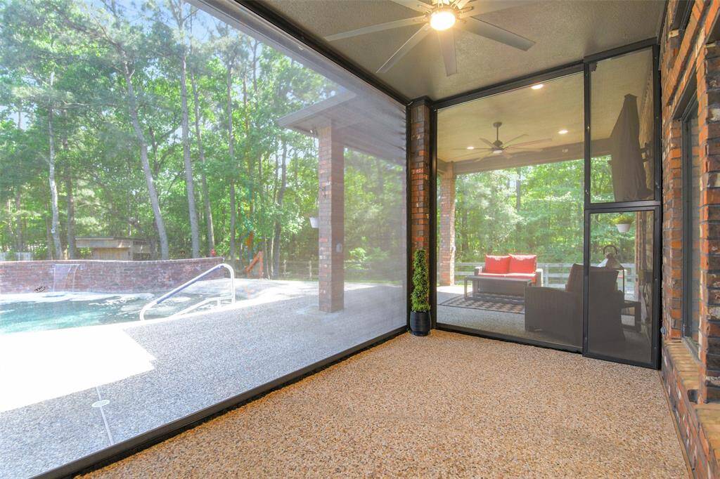 Step out of your home to a large covered patio. This portion of the patio has a remote controlled screened in feature.