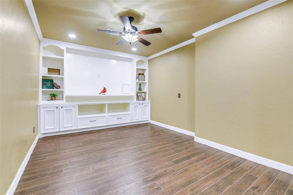 Custom Media room located off of the kitchen and Mud room.