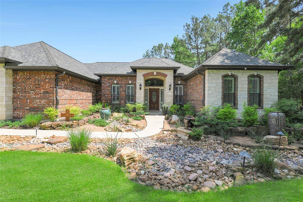 Custom landscaped home is beautiful year round!