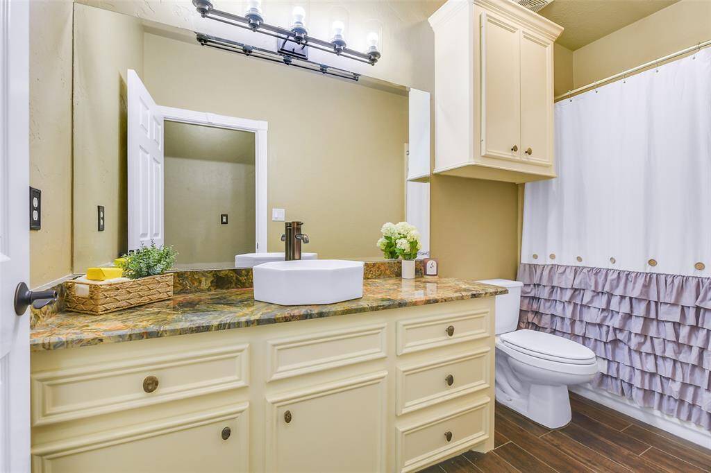 Full bath! Custom counters, vessel sink, tile flooring, updated lighting.