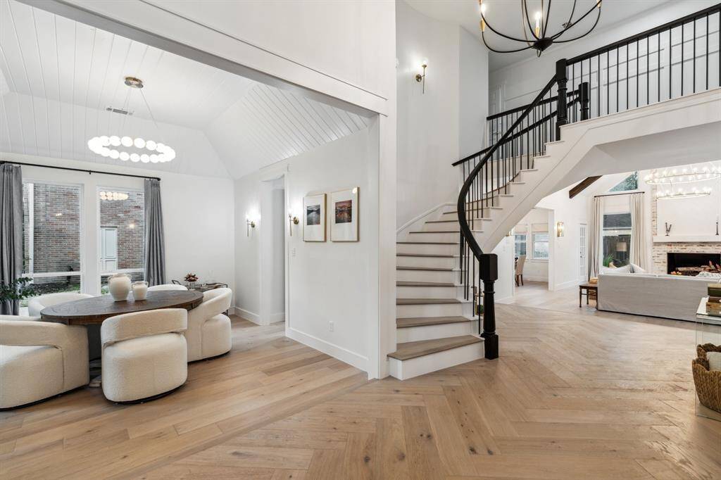 Featuring wood floors throughout with a herringbone pattern in the foyer, tall ceilings, custom wood details throughout, all new chandeliers and fixtures, and more.