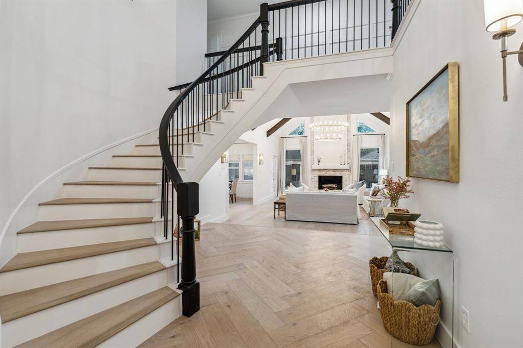 Located upstairs are three large bedrooms, 2 full bathrooms, a huge storage closet, and a large extra space at the staircase landing that could be used as a play area.