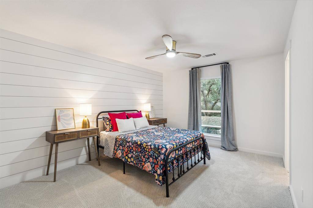 This is one of three large upstairs bedrooms. This room showcases a shiplap wall, large walk-in closet. All new carpet upstairs.