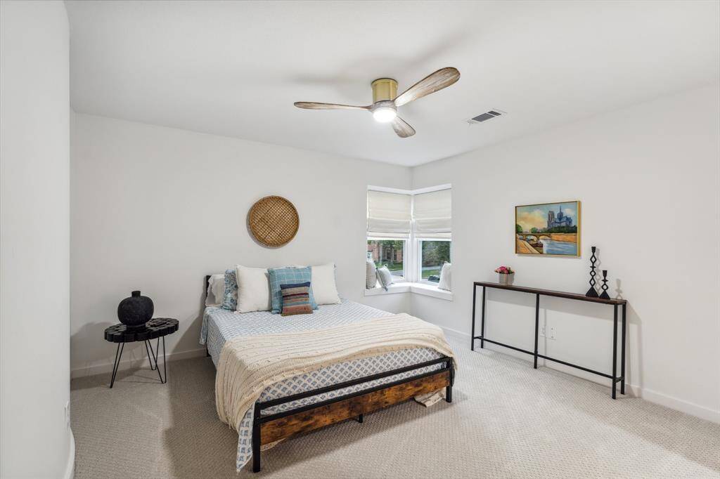 This bedroom has the en-suite bathroom and an inset window with window seating