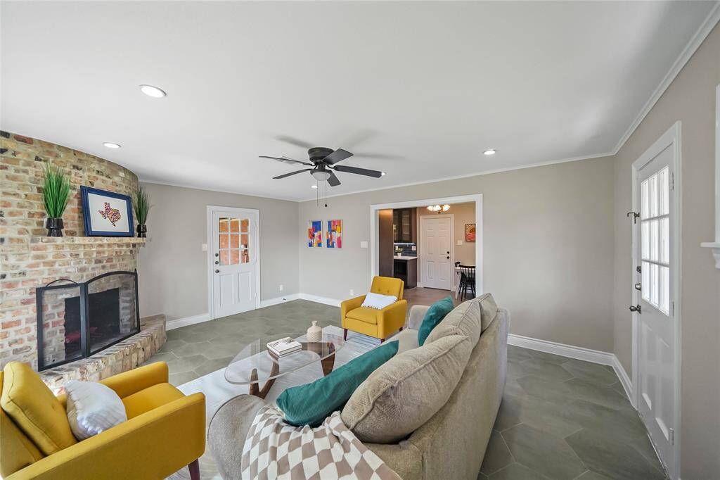 The door straight ahead opens to a covered patio and an expansive backyard with multiple entertaining spaces, perfect for gatherings and relaxation.