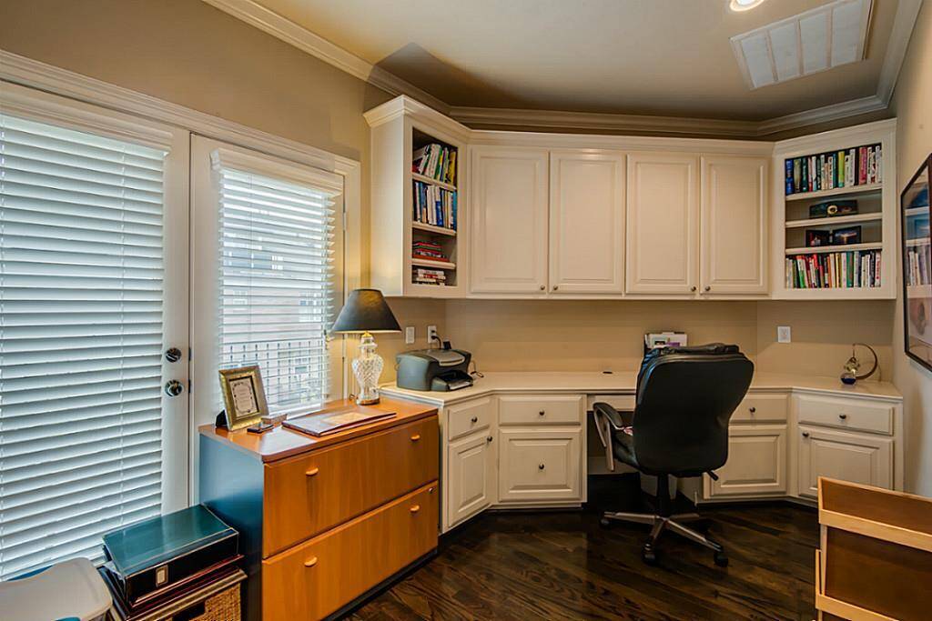 Third level features a wonderful built in desk with cabinets for those who need a home office!