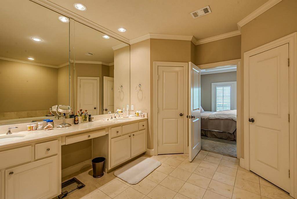 The generous master bathroom features an expansive vanity with double sinks and plenty of storage for your toiletries!