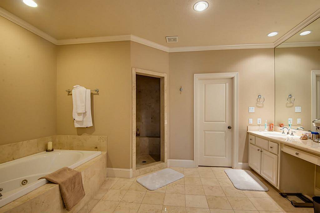An oversized jetted tub and spa-like walk-in shower enhance the master retreat, adding a sense of tranquility and luxury!
