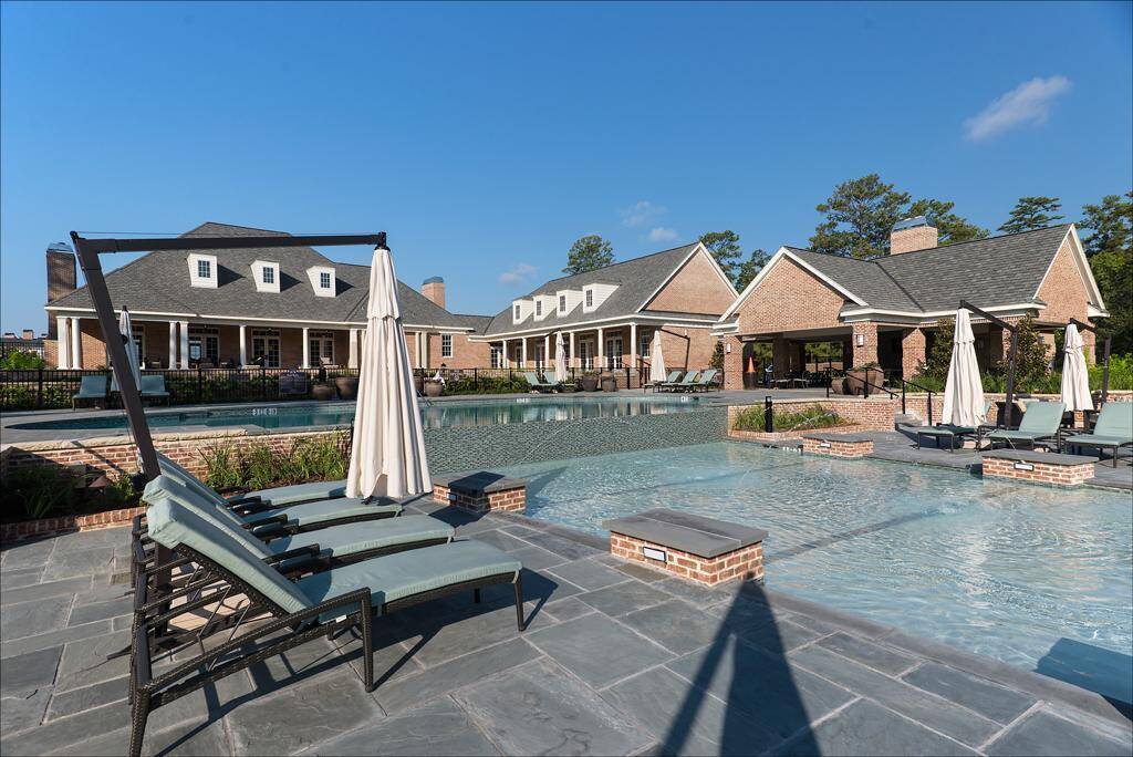 What a stunning community pool! It truly is the epitome of luxury with water features, tanning areas, and an expansive pool area! East Shore also features many walking/running trails that allow you to roam freely for a great work out!
