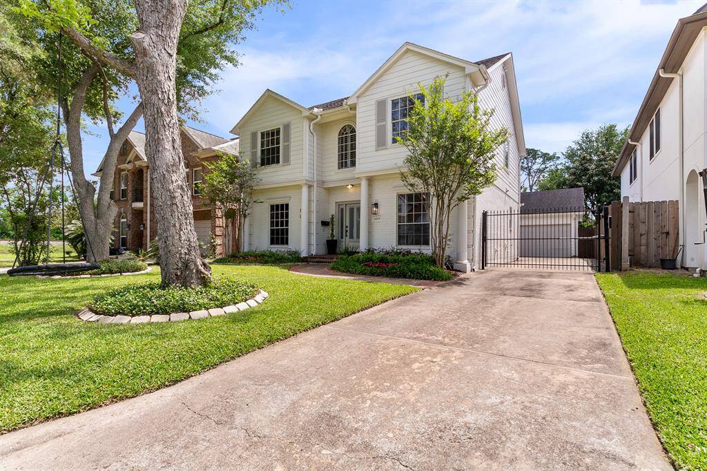 Enjoy the shade of mature trees and the privacy of an automatic gated driveway.