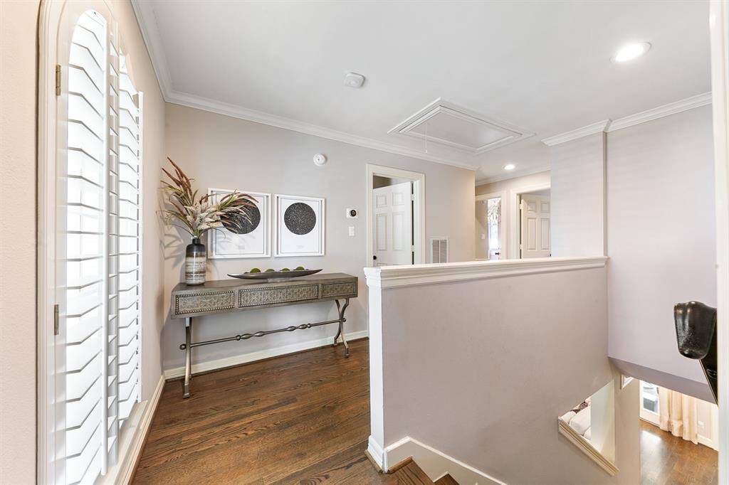 Spacious landing area on the second story has a wall of windows to fill the space with natural light.