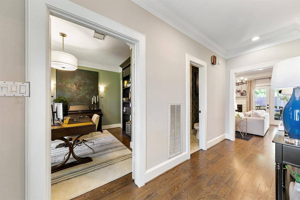 To the left of the entry is a bonus room that is currently being utilized as a home office. The doors, large walk-in closet and proximity to the first floor updated bathroom allow it to be easily utilized as a 5th bedroom.