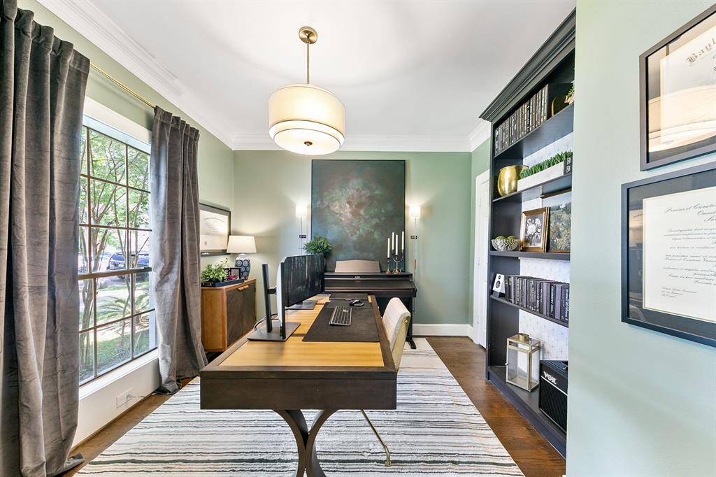 Every inch of this room is beautifully designed from the warm paint color to the hardwood floors and the built-in bookshelf.