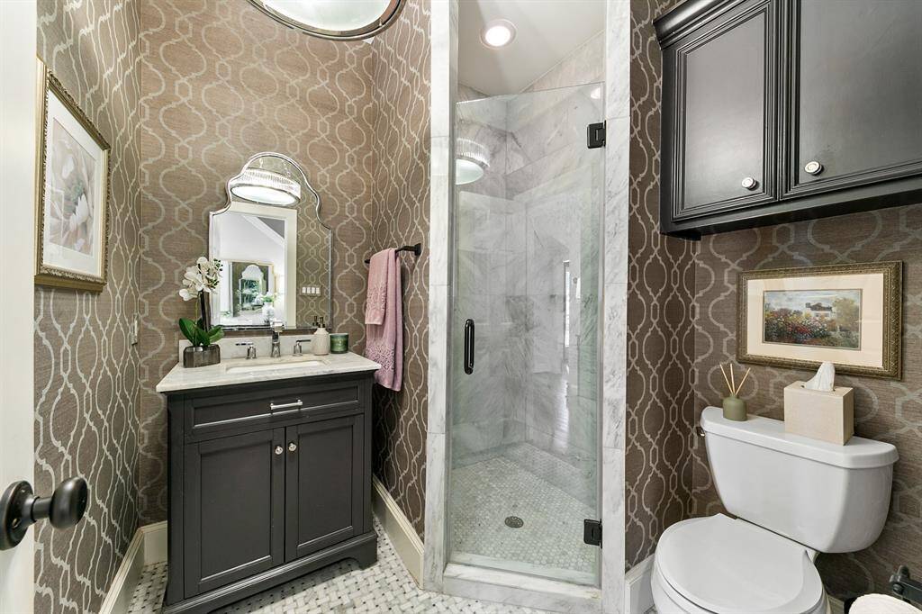 Gorgeous first floor full bathroom is beautifully designed and conveniently located next to the bonus room and living room.