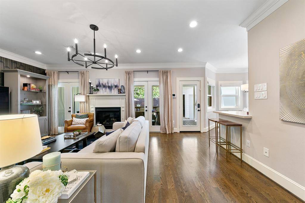 The main living space is warm and inviting.  The lovely hardwood floors flow seamlessly throughout the first floor.