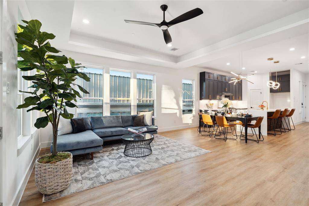 This open floor plan deign has small details such as a recessed tray ceiling in the living room to give way to design and separation in the home while keeping an open feel.