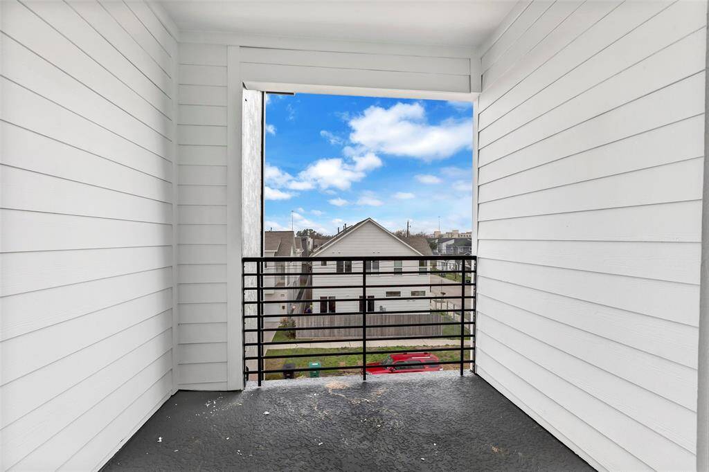Just off the main bedroom, this private balcony offers an even better view of the neighborhood, perfect for relaxing and enjoying the scenery.