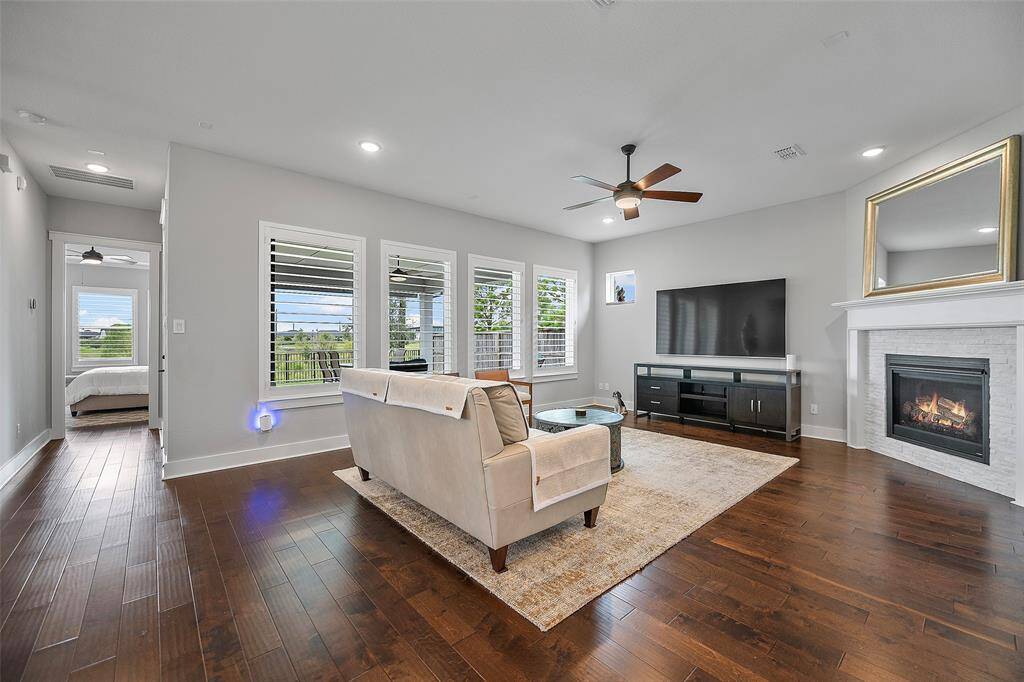 And we'd be remiss if we didn't mention these gorgeous hardwood floors that flow throughout most of the home! There is NO CARPET, which is so much easier to maintain! And look at those views, with NO REAR NEIGHBORS!