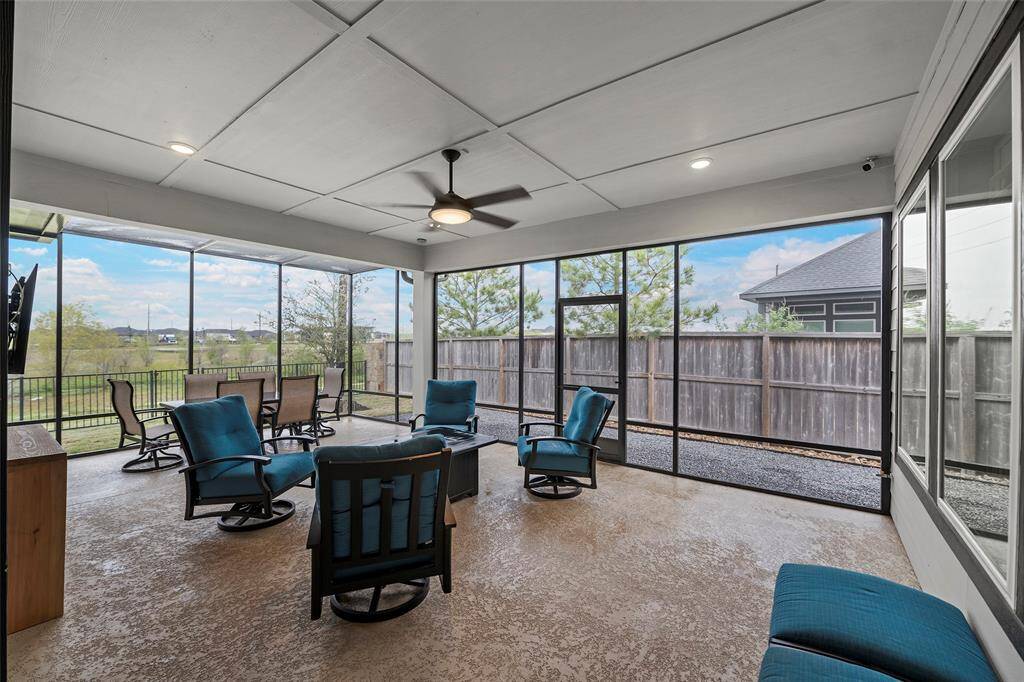 Step outside onto this AWESOME covered patio complete with finished decking, recessed lighting and a breezy fan for those hot summer days!
