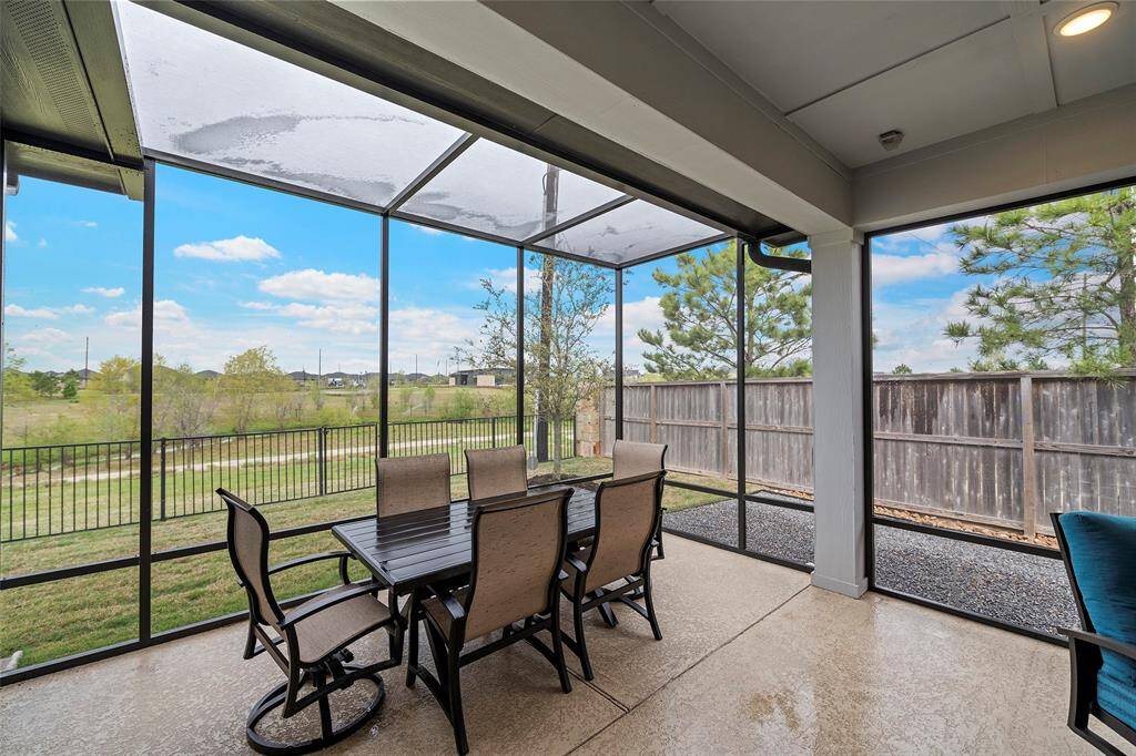 A covered, screened in patio with skylight views, making evenings oh so enjoyable!