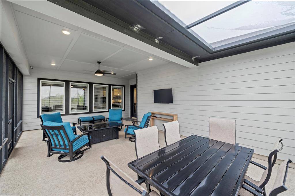 This table is seated to perfection under the skylight part of the screened in patio, making evenings for dining al fresco one of your new favorites!