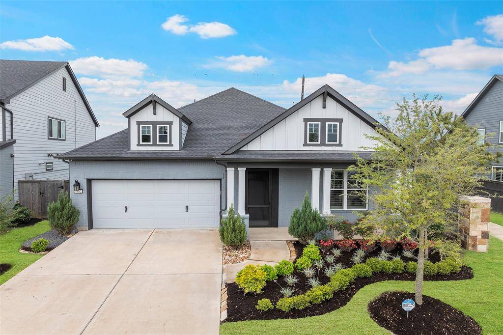 Mature landscaping softens this charming home, offering such great curb appeal! The exterior boast colors of nature and just blends so nicely!