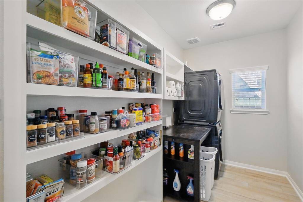Walk in pantry and laundry room. There is more storage not pictured here! So functional!