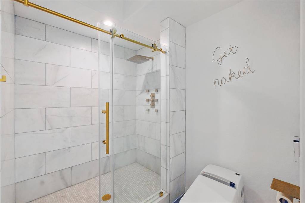 Stunning marble tile walk in shower.